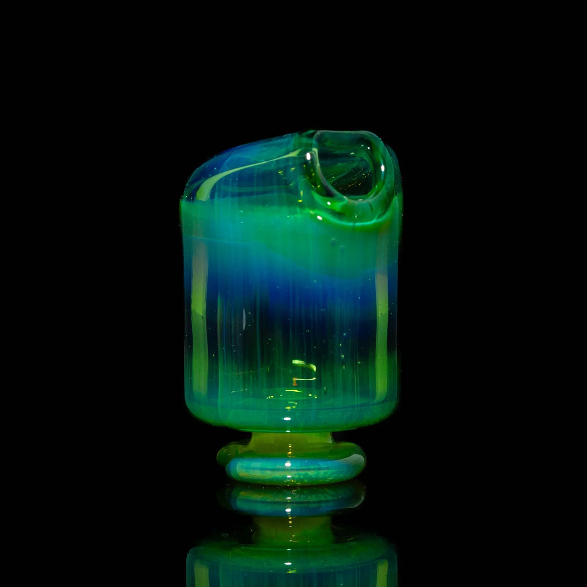 Handcrafted green and blue glass mouthpiece with glossy finish on black background