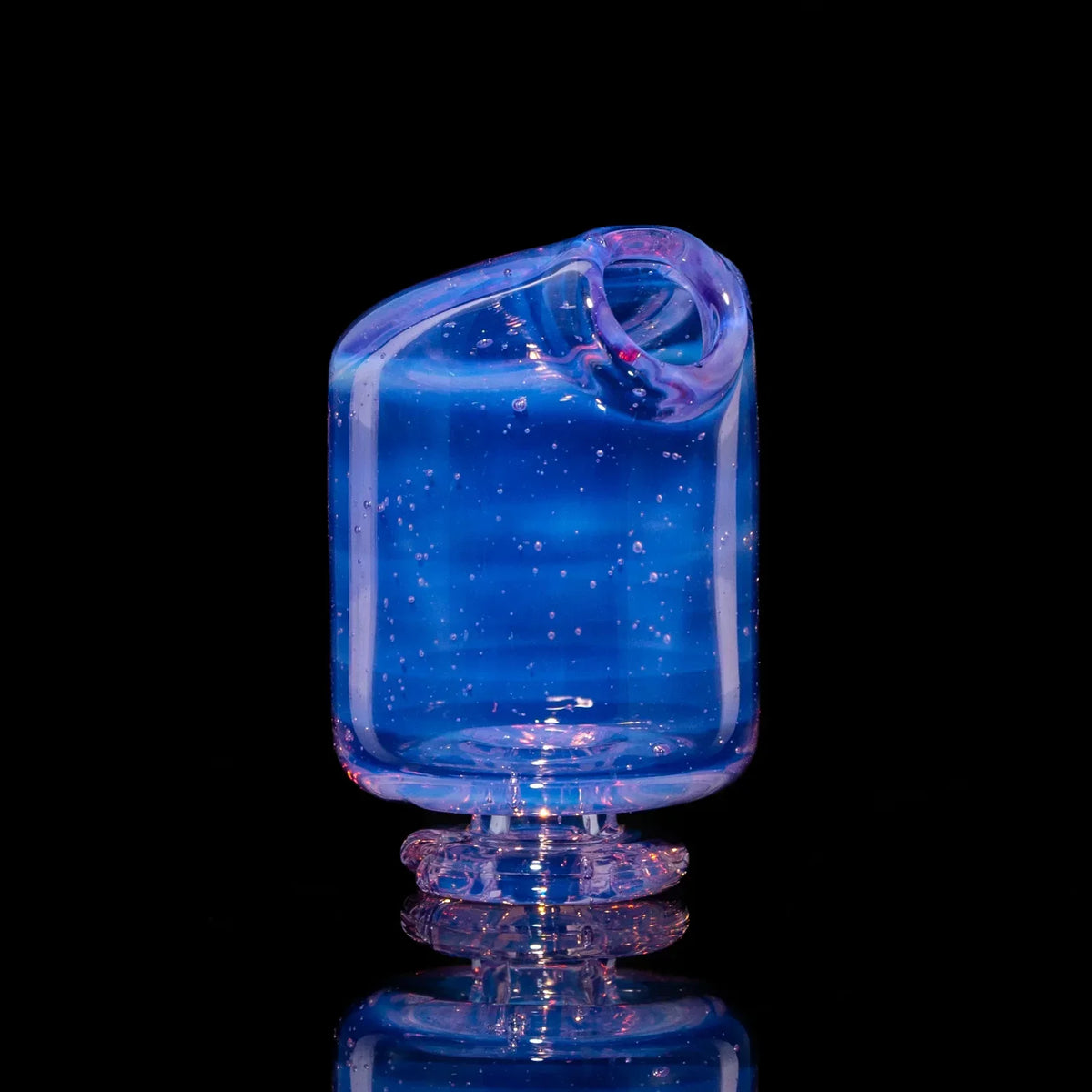 Iridescent pink and blue glass mouthpiece with pearl detail on a black background.