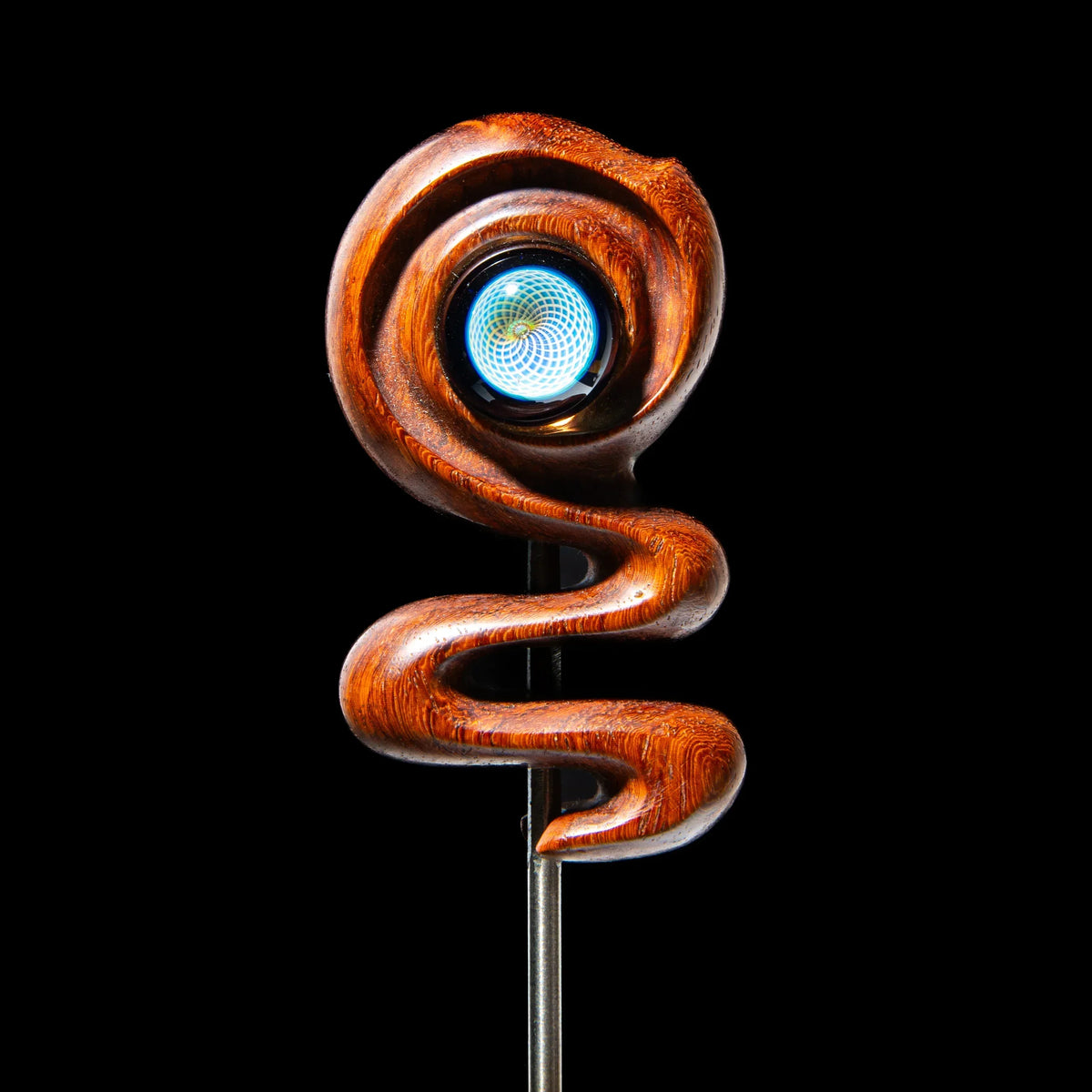 Handcrafted glass dab tool with intricate wooden handle and blue spiral design, black background
