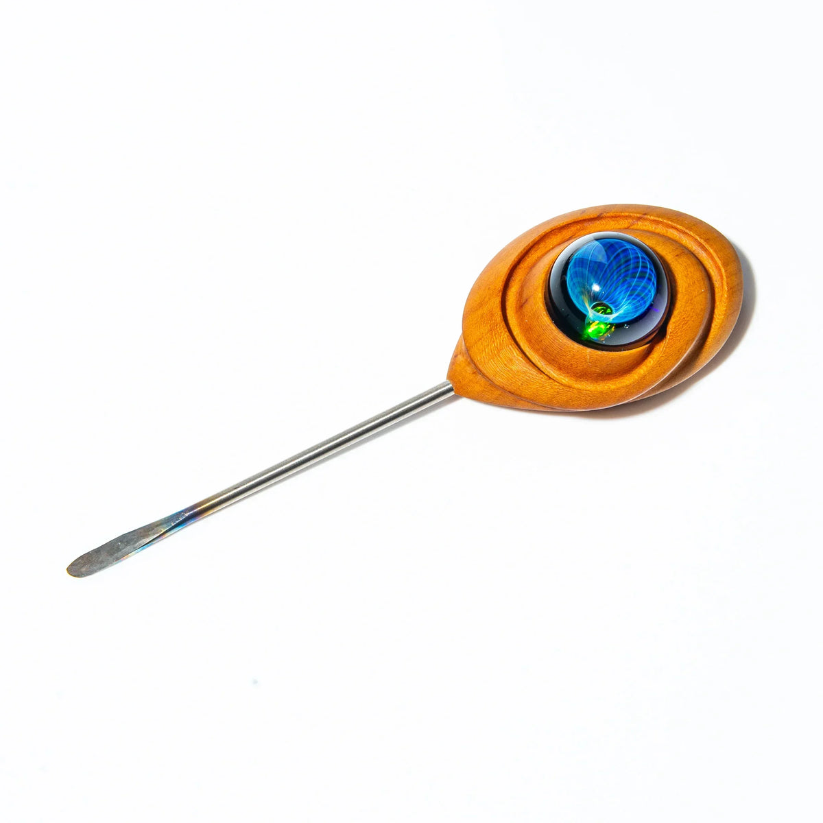 Glass dab tool with a wooden handle and blue decorative accent on white background