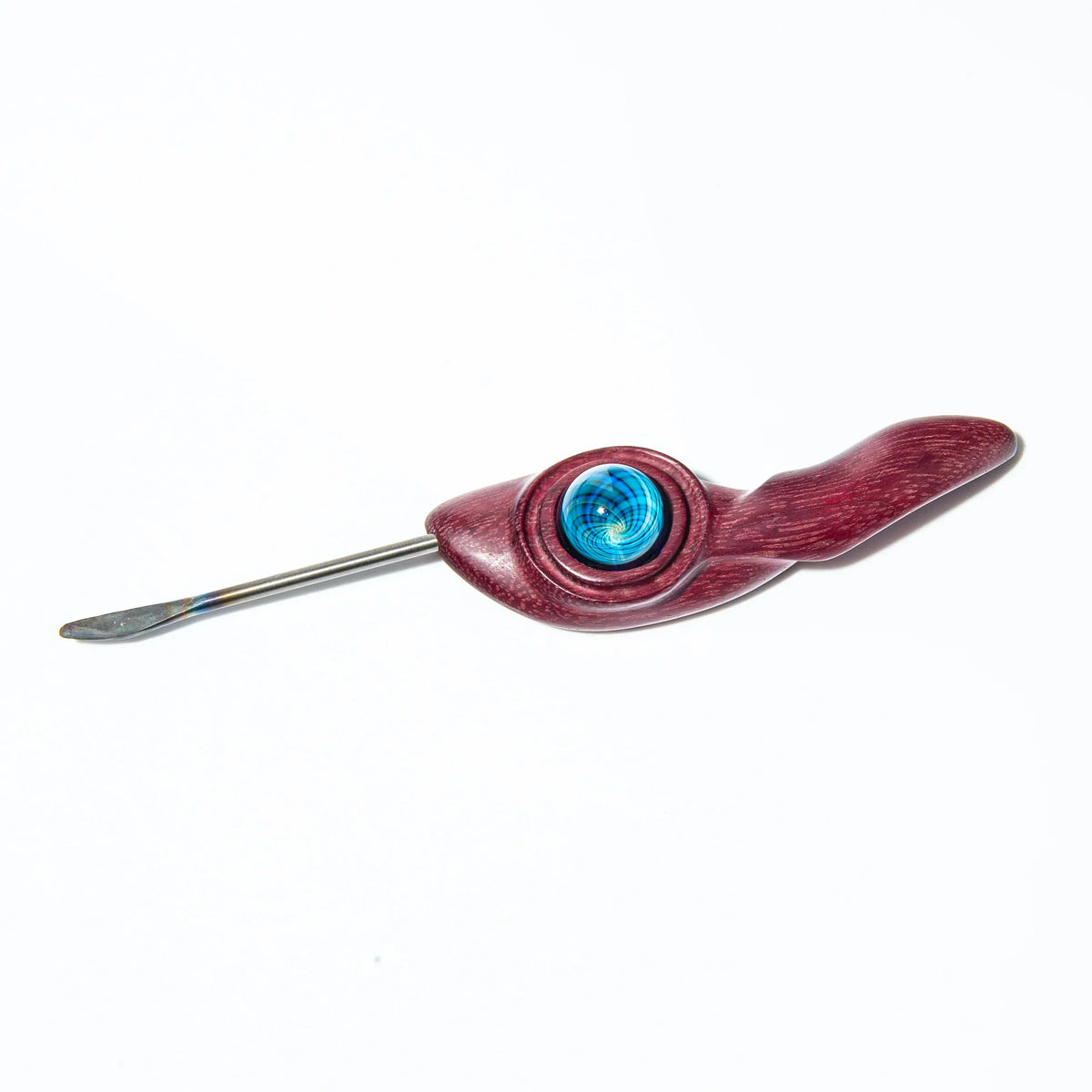 Wooden dab tool with blue glass marble accent and stainless steel tip on white background