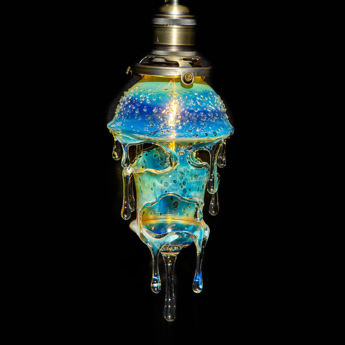 Hand-blown glass lamp with dripped, bubble-filled design and iridescent blue hues