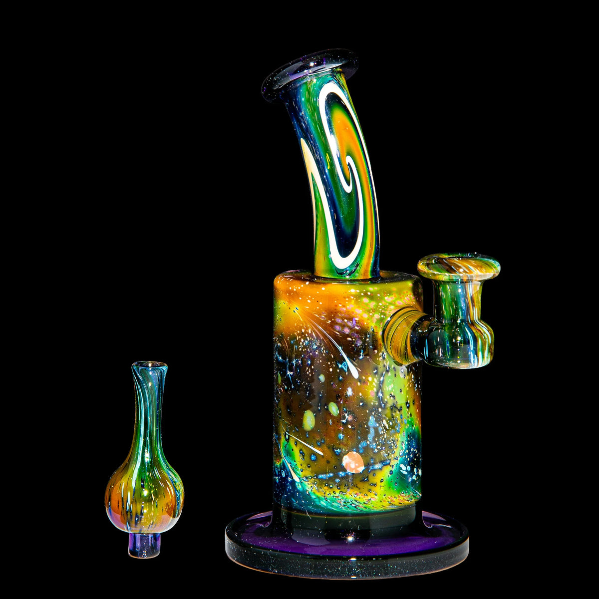 Heady glass water pipe with vibrant galaxy swirl design and matching glass accessory on black.