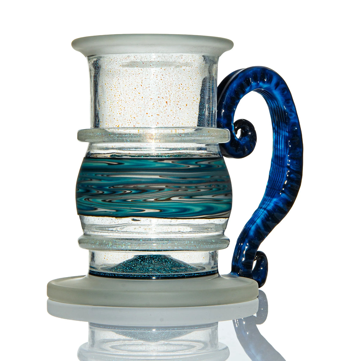 Artistic glass mug with blue swirled handle and teal, black marbled accent band