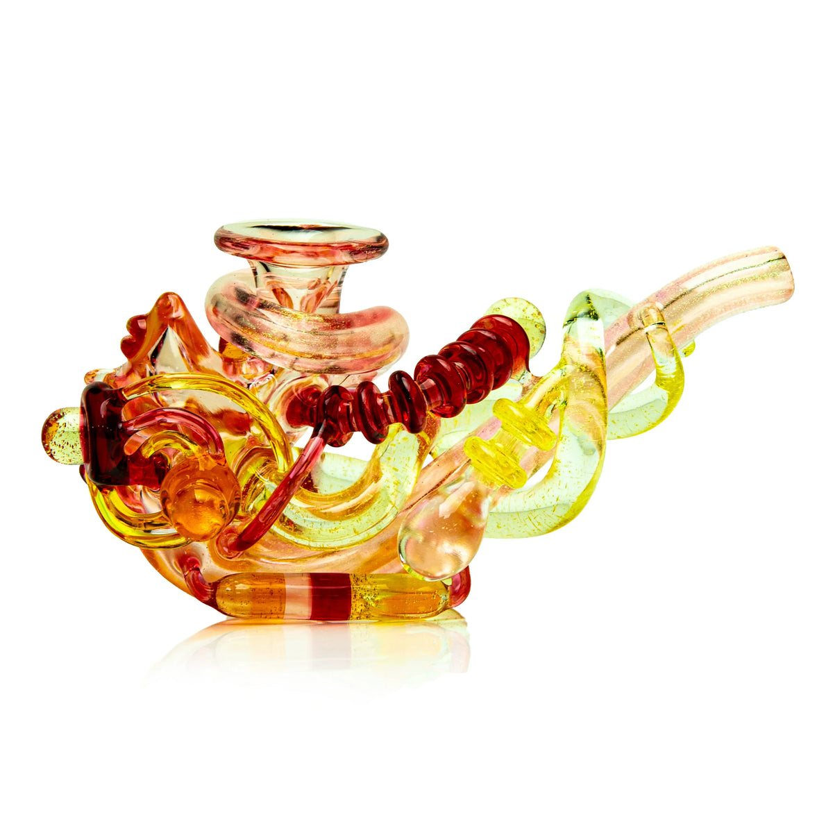 Heady glass pipe in yellow and orange with swirling, intricate design on white background