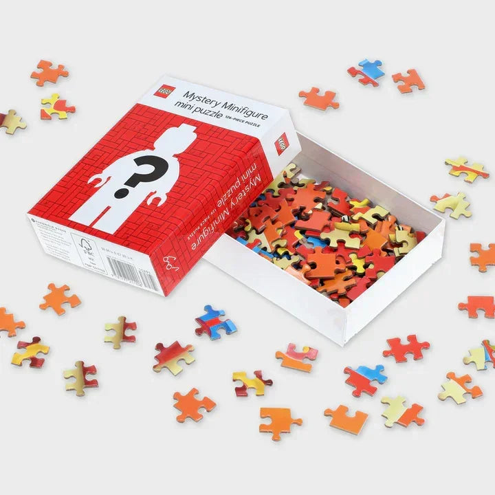 LEGO Mystery Minifigure mini puzzle box with scattered colorful puzzle pieces