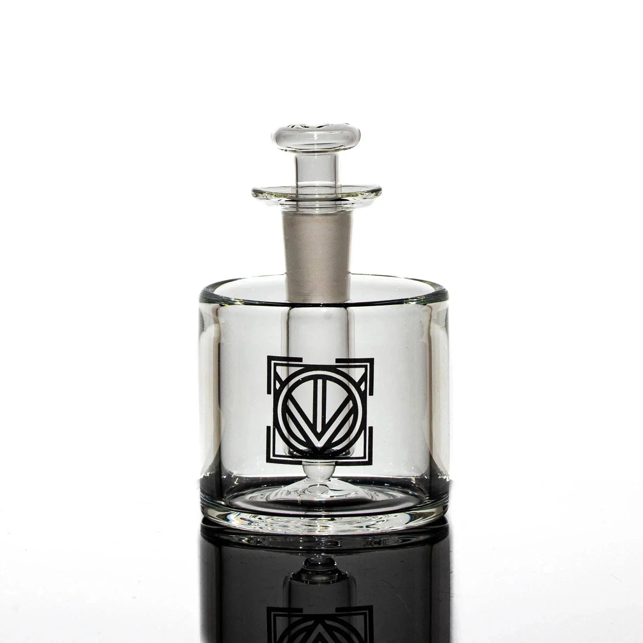 Clear glass cleaning station jar with black geometric logo, designed for smoking accessories.