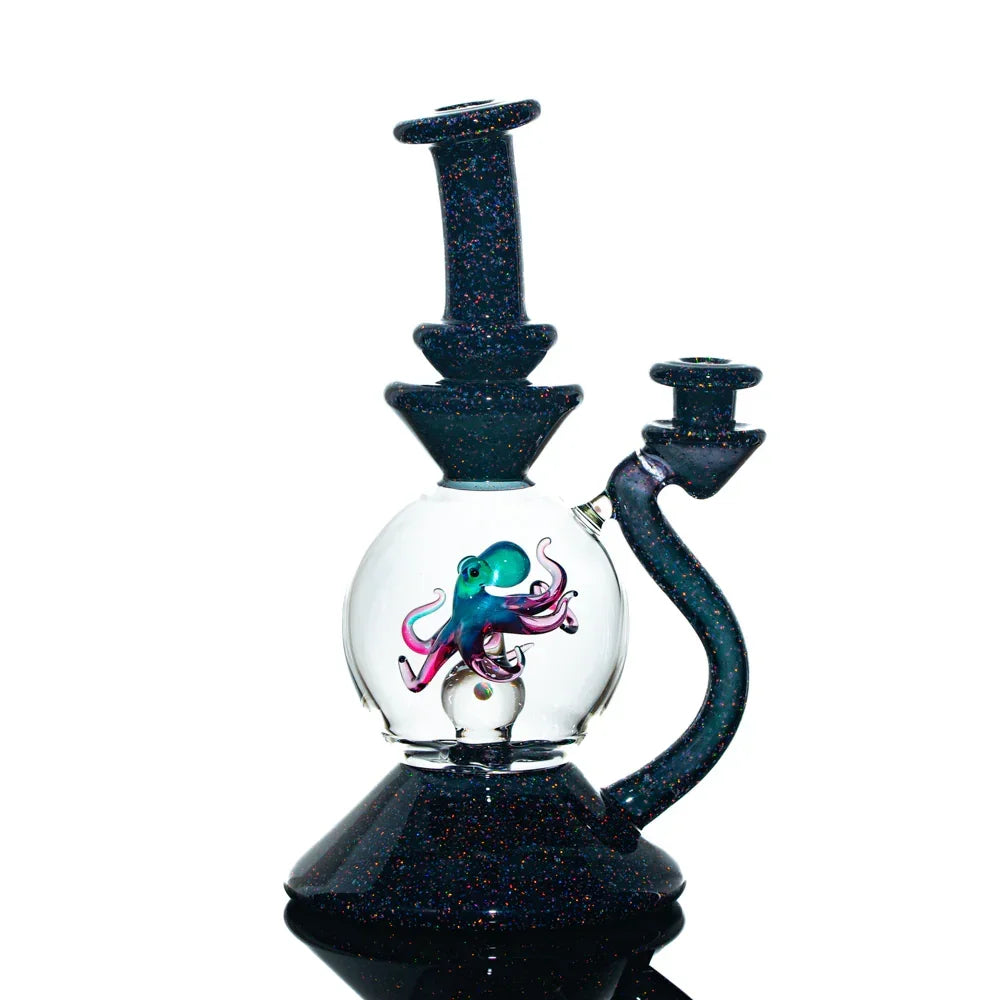 Heady glass water pipe with black opal design and detailed octopus sculpture inside the chamber