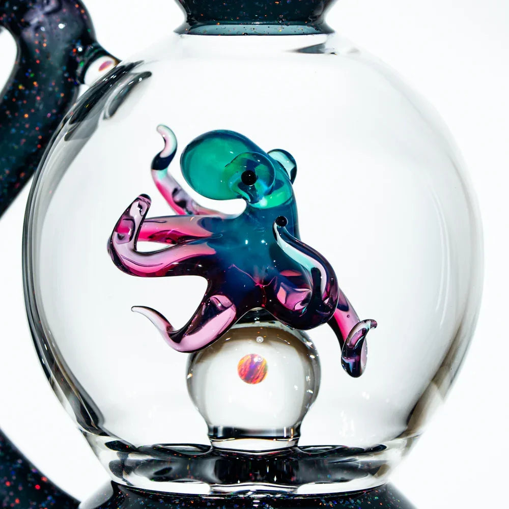 Hand-blown glass water pipe with colorful octopus and opal marble detail inside the chamber.