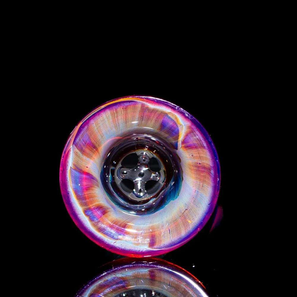 Amber and purple glass slide bowl with four-hole design, displayed on black background