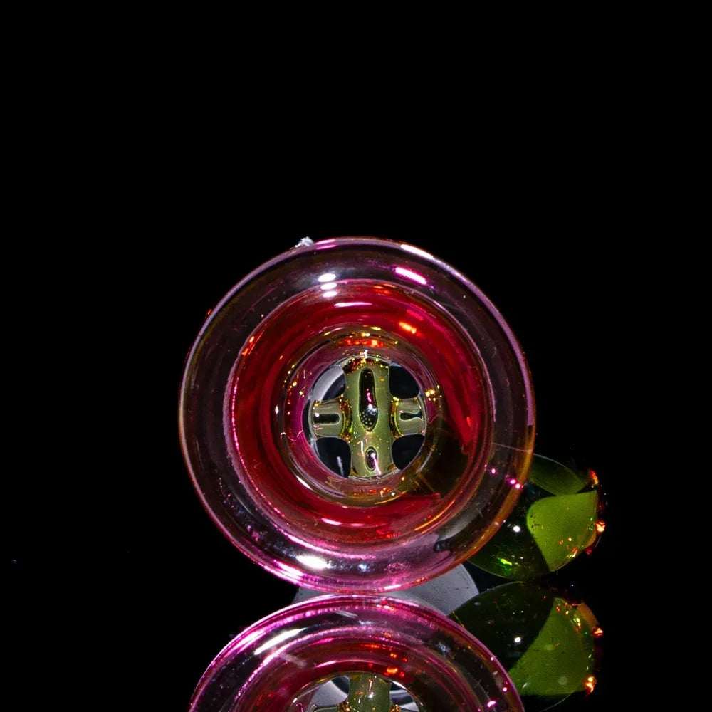 Heady glass 18mm slide with green four-hole design, reflective black background