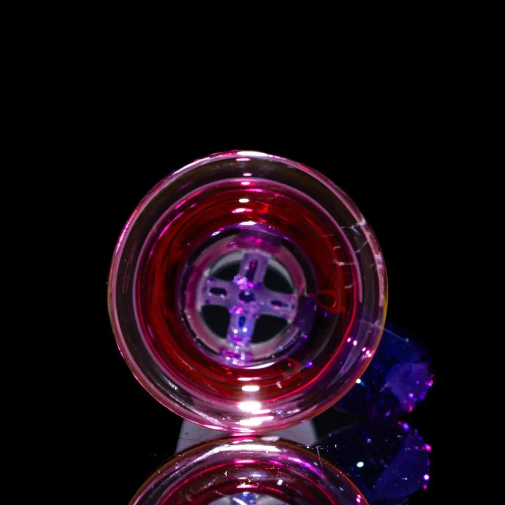 Purple and pink glass bowl with four-hole design for water pipe, displayed on black background