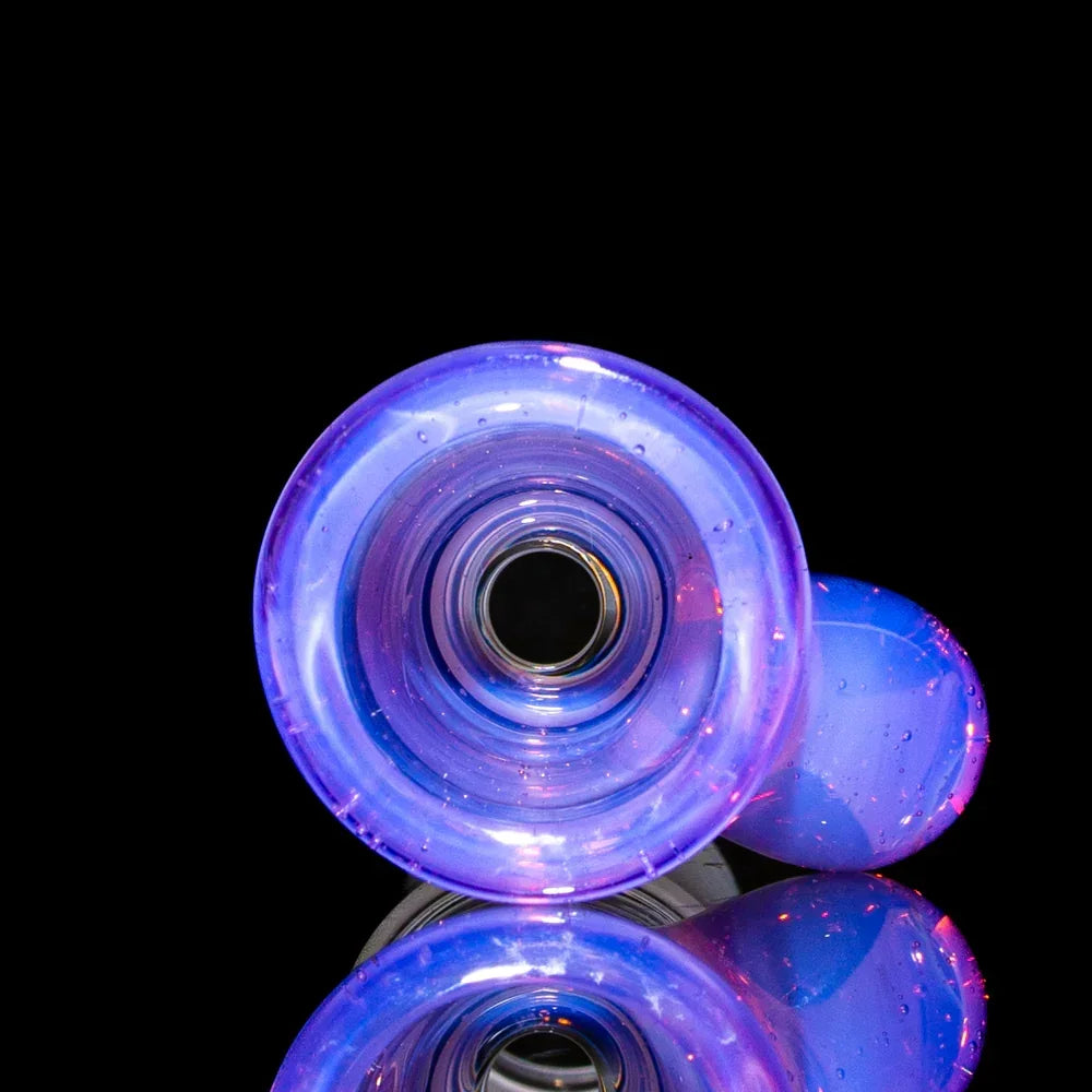 Rose quartz 18mm glass martini slide with pink and purple hues on black background