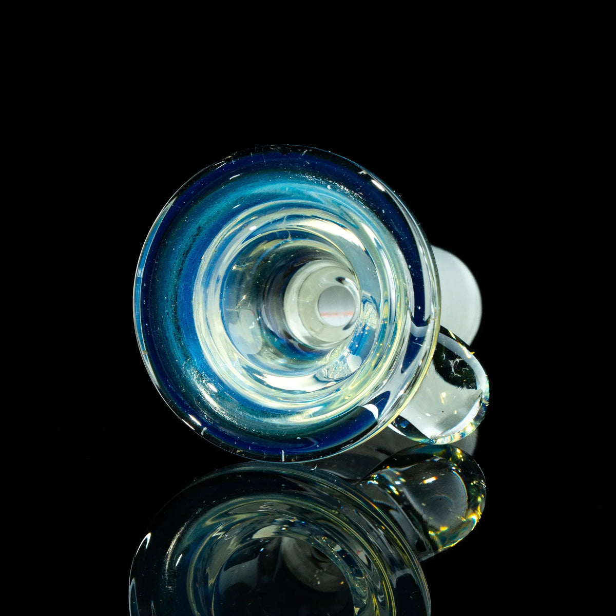 Handblown glass bowl slide with blue and silver fume accents on a black background