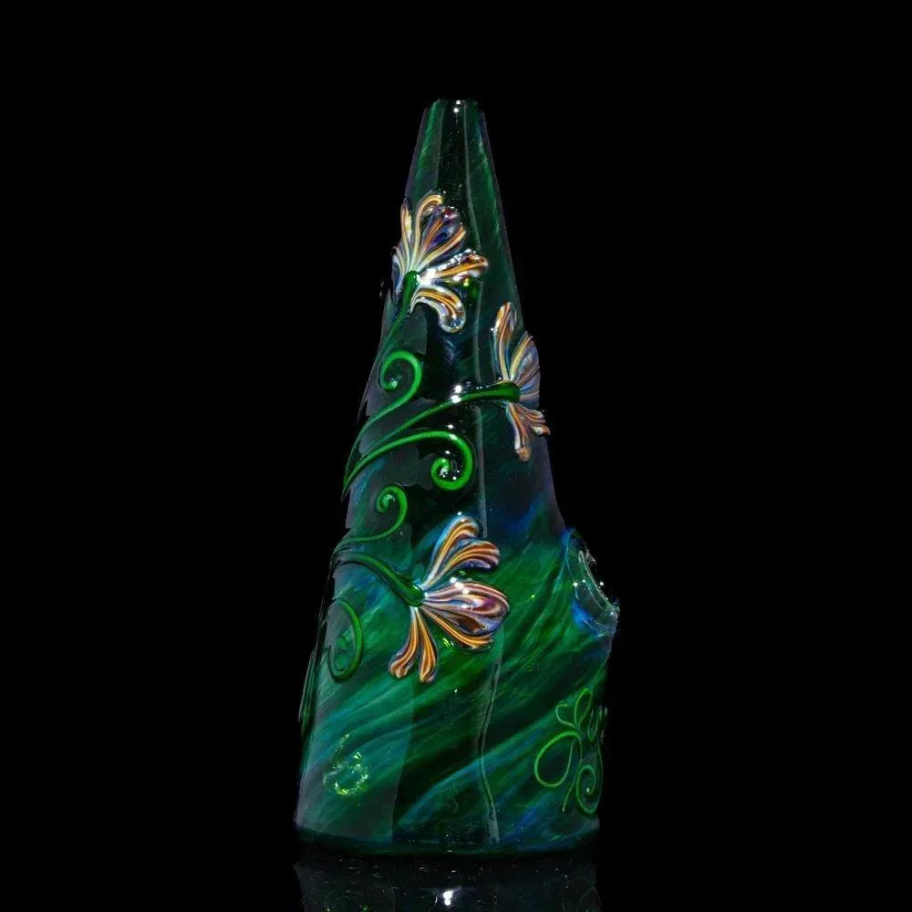 Green glass water pipe with swirling patterns and detailed flower accents on black background