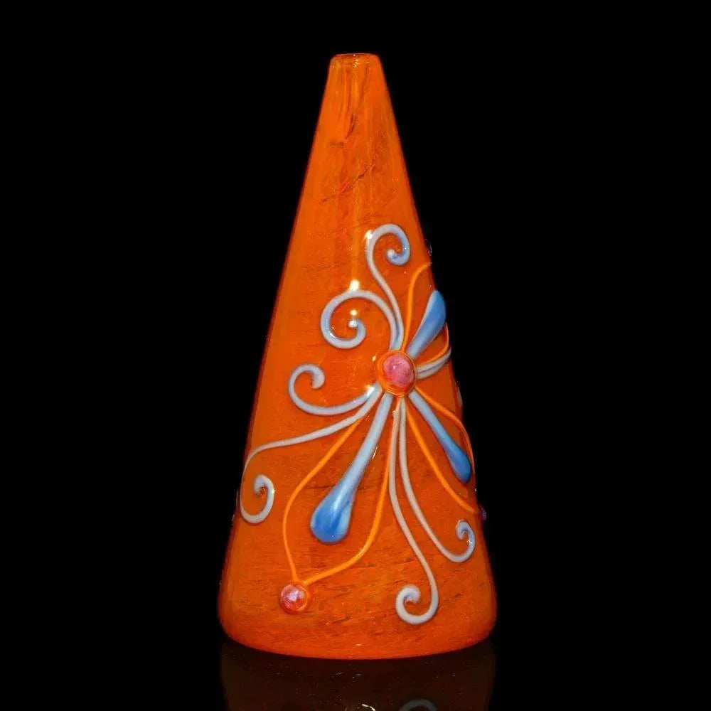 Cone-shaped orange glass rig with blue and white flower design on black background