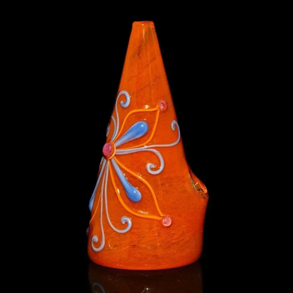 Orange glass rig with blue and pink floral accents on a black background