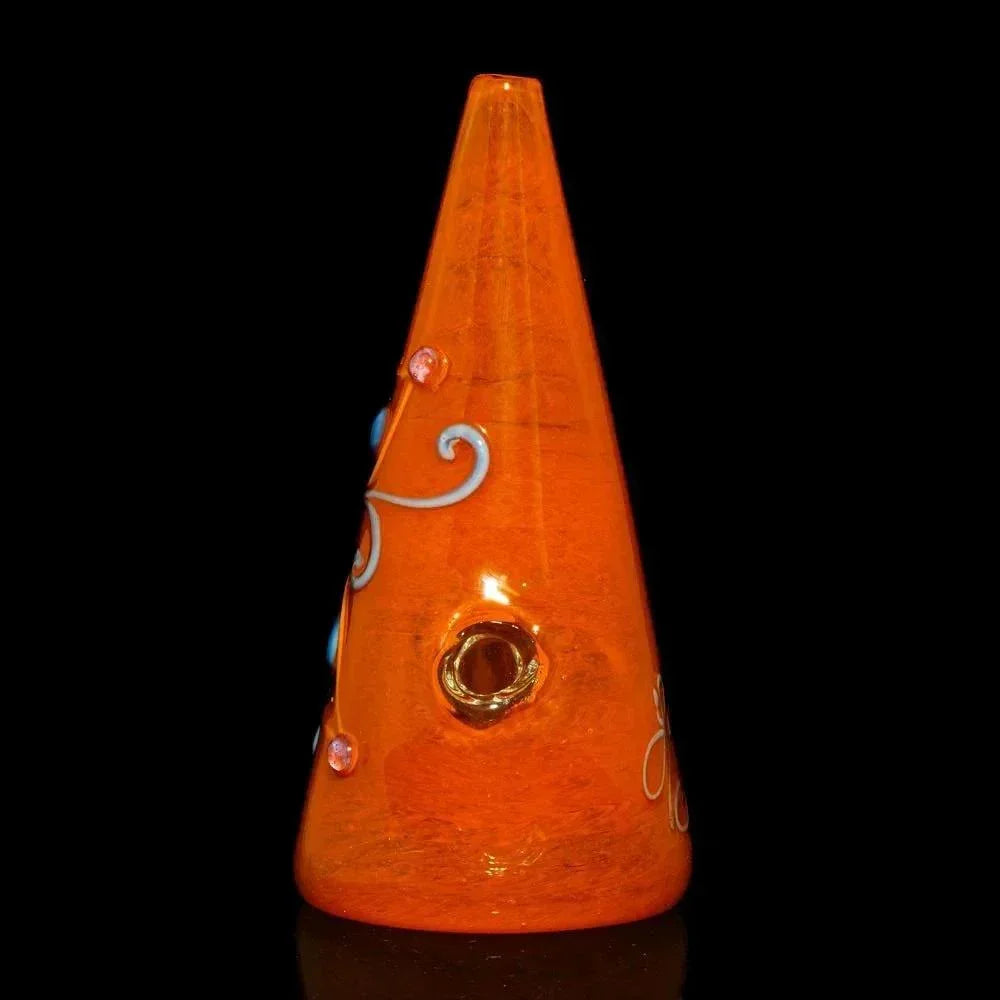 Cone-shaped orange glass rig with decorative flower and swirl accents, black background