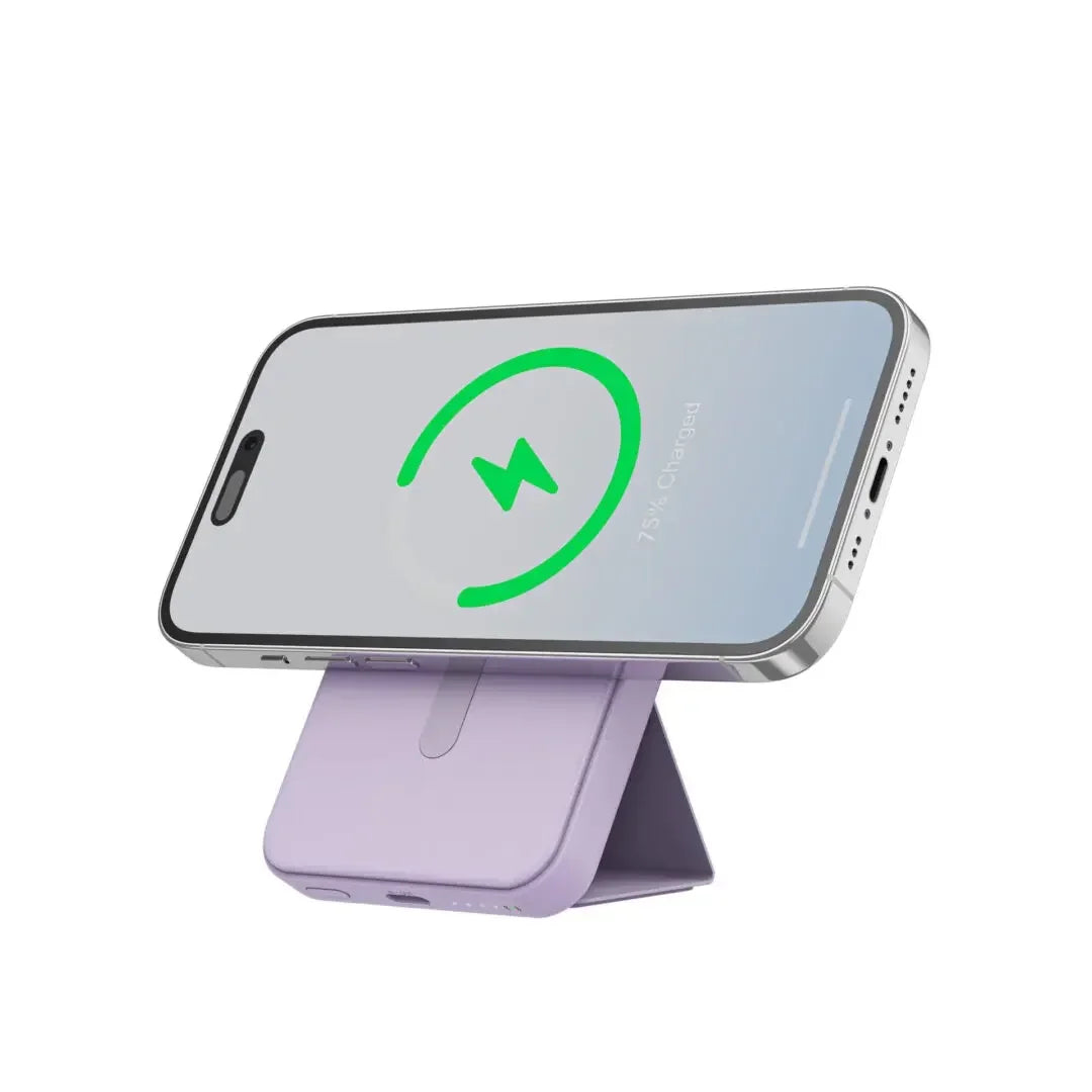 Smartphone on a magnetic wireless charging stand with battery status, isolated on white background