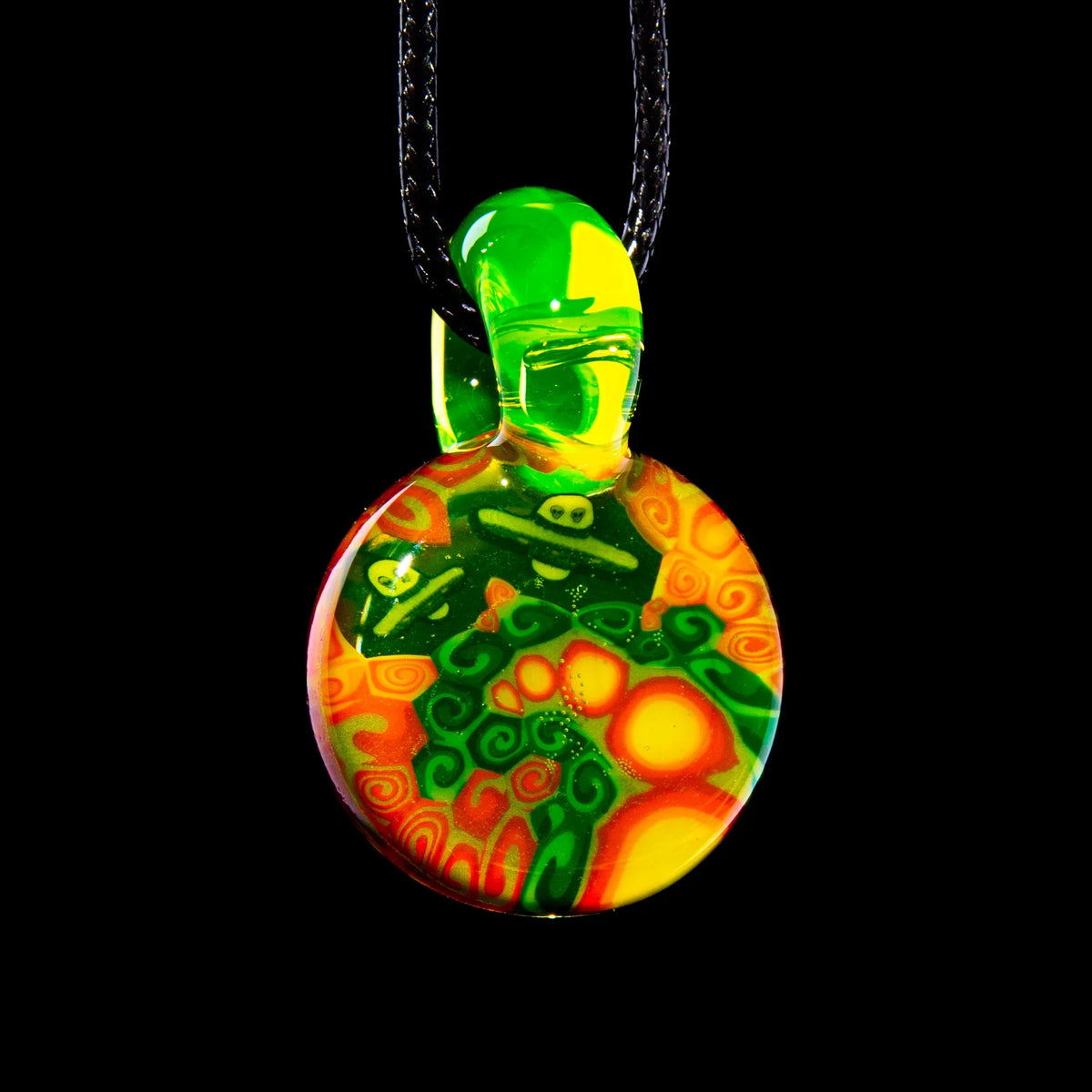 Colorful glass pendant with green, yellow, and orange swirls on black cord