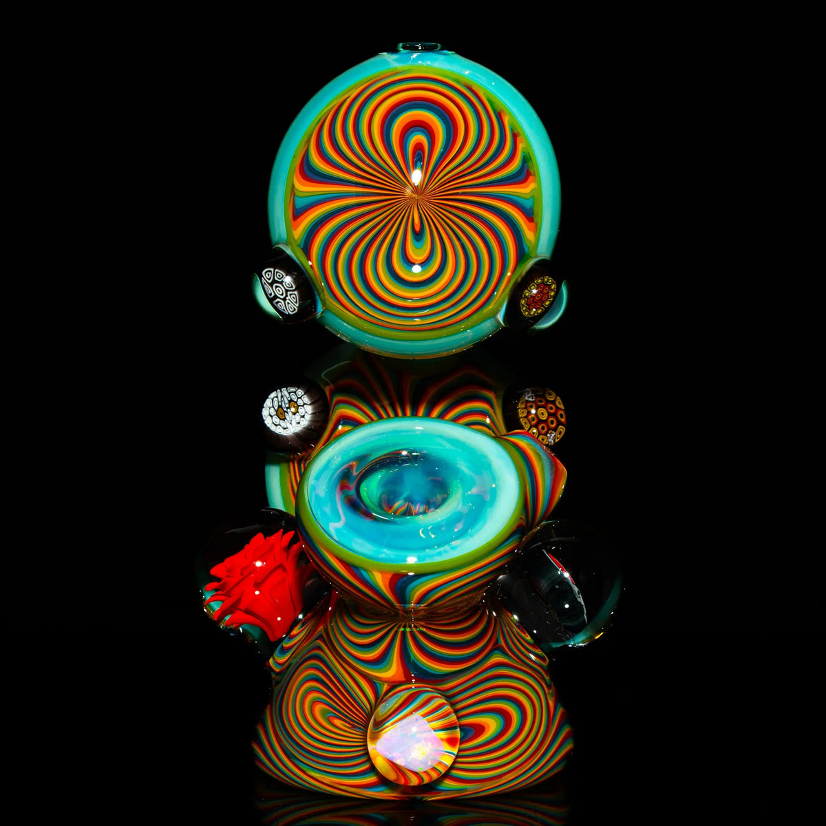 Colorful heady glass art piece with vibrant swirling patterns and decorative marbles