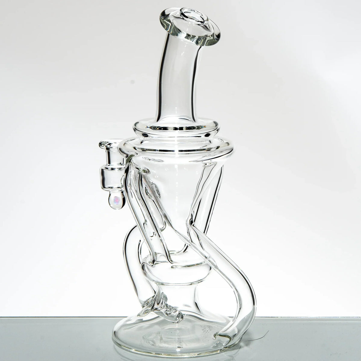 Clear glass recycler water pipe with intricate tubing and curved neck on white background
