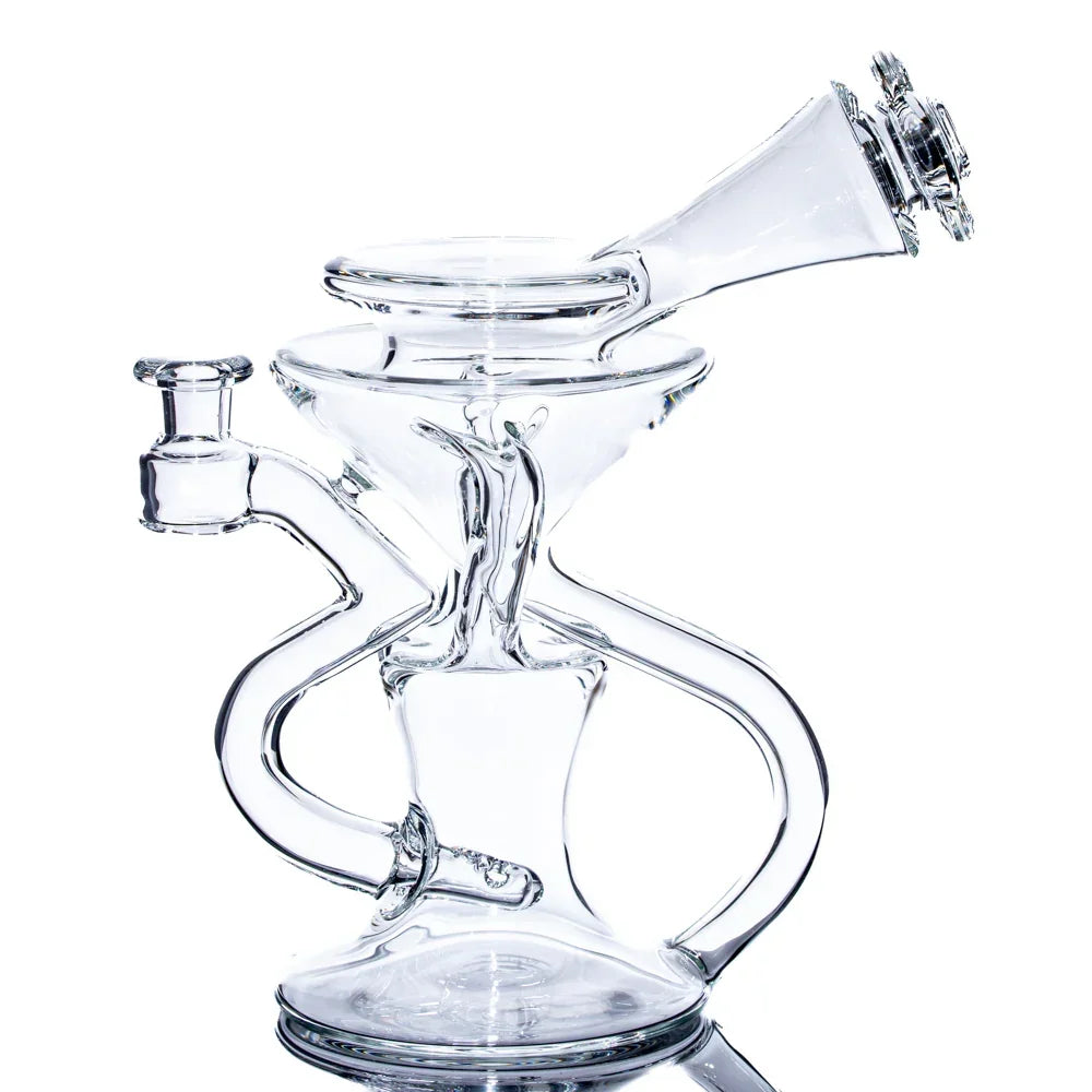 Clear glass recycler water pipe with unique twisted chambers on a white background