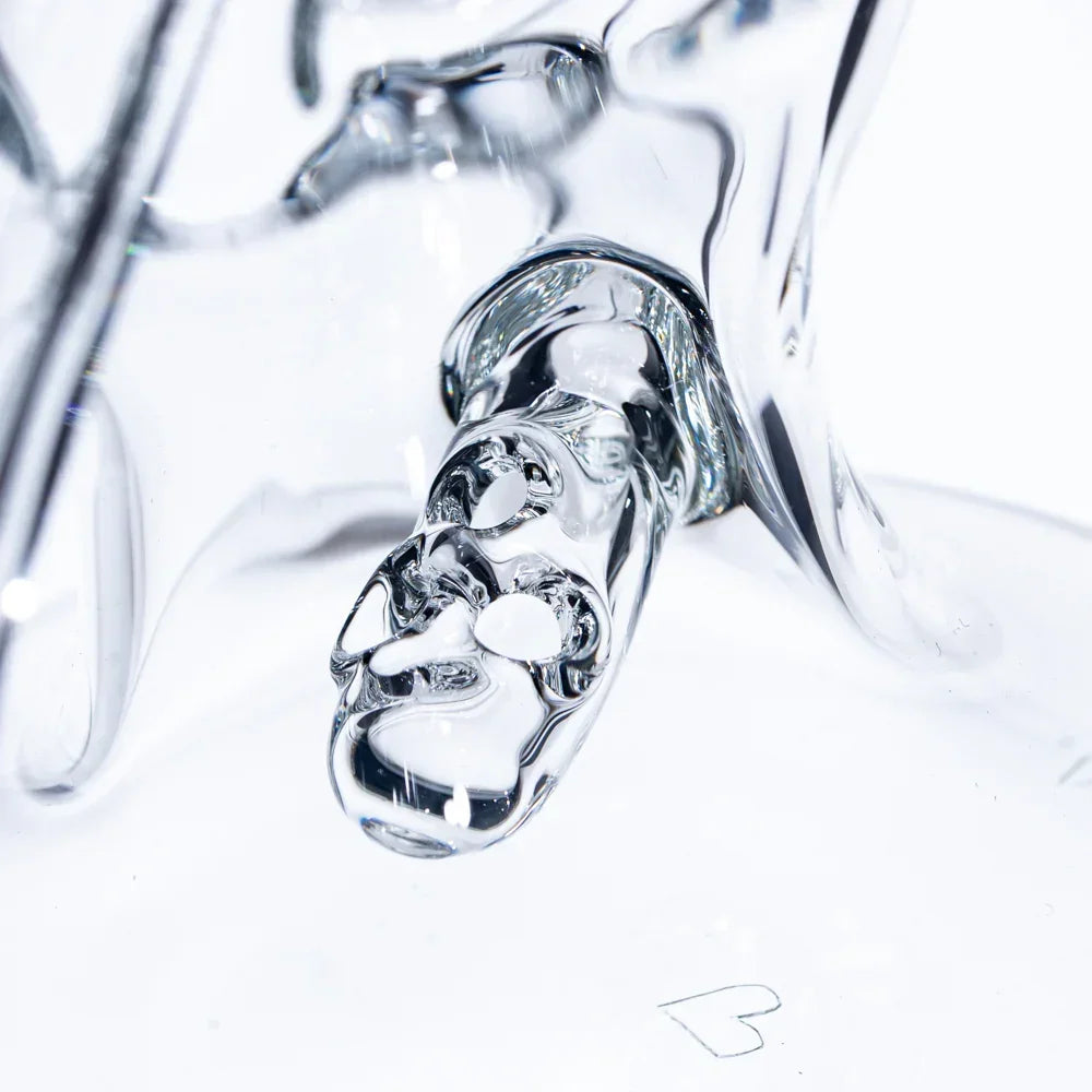 Close-up of a clear glass percolator with intricate recycler design for filtration