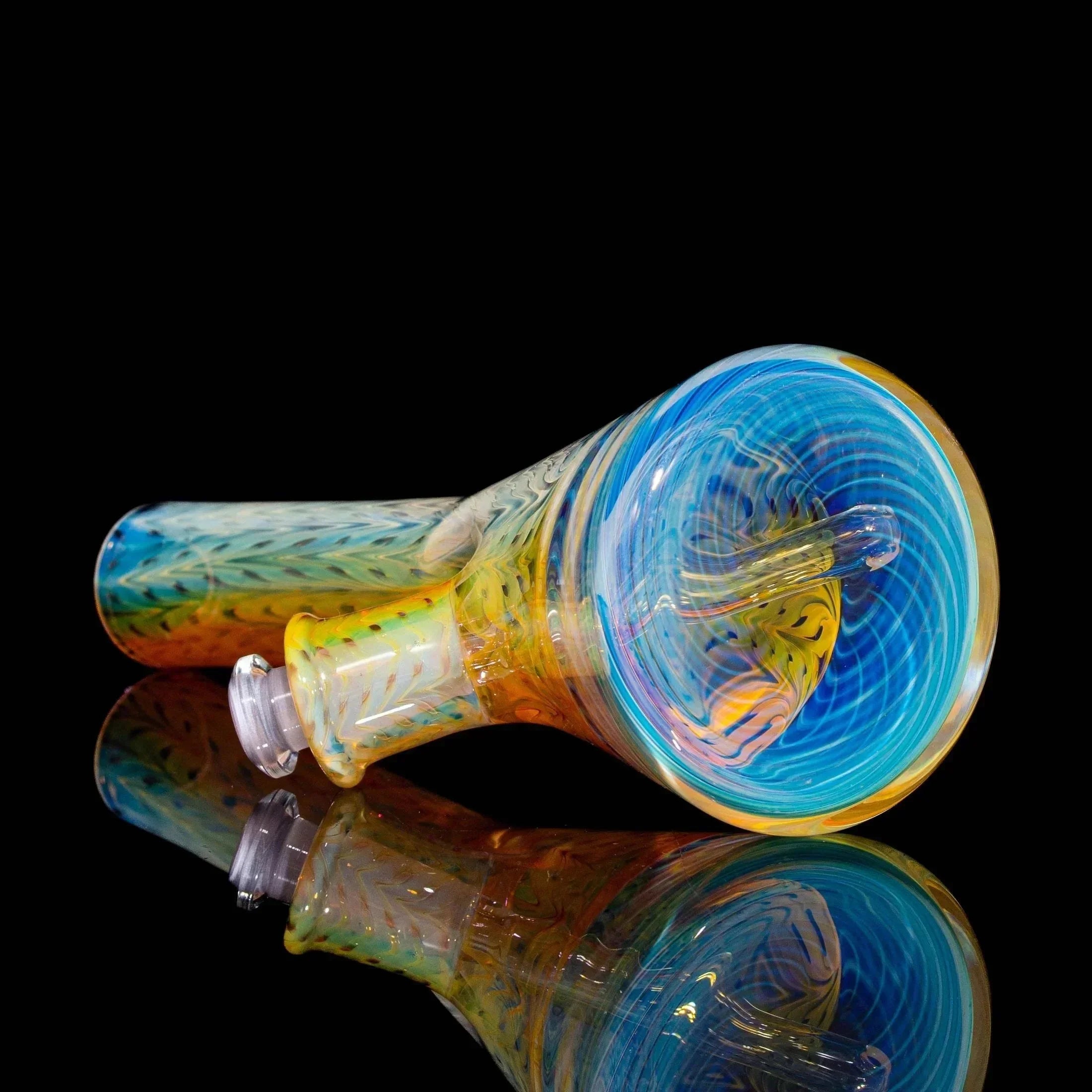 Handblown glass pipe with blue spiral tube design, yellow accents, on black background.