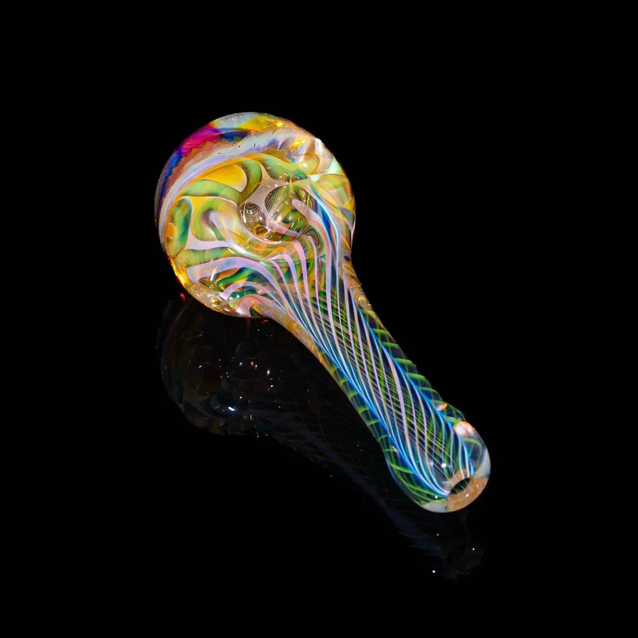 Colorful hand-blown glass spoon pipe with vibrant swirls on black background