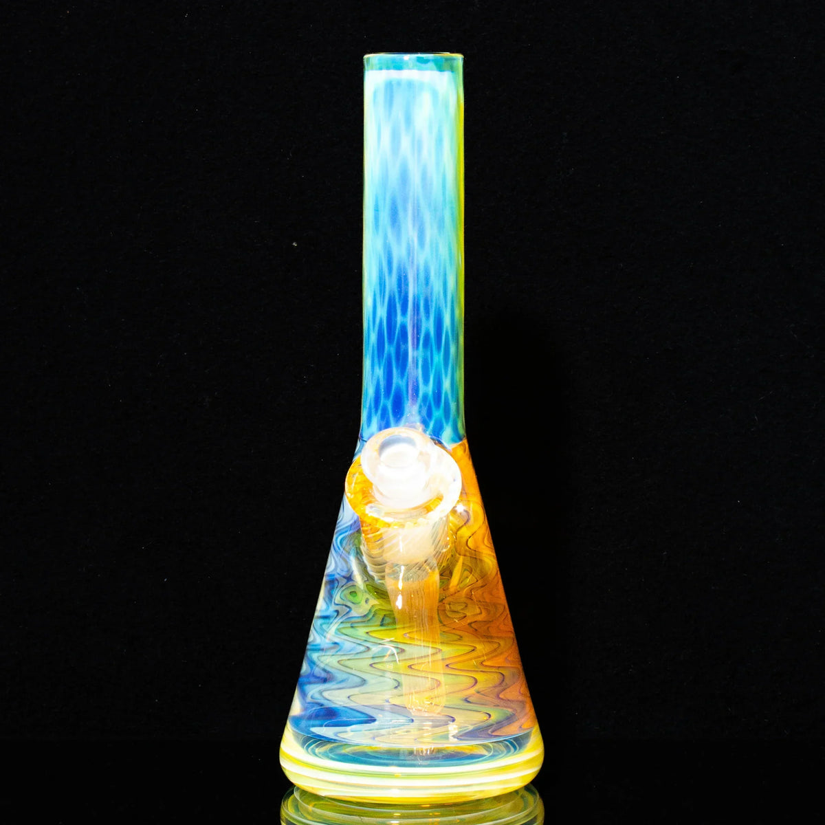 Colorful glass mini water pipe with honeycomb and linework design on a black background