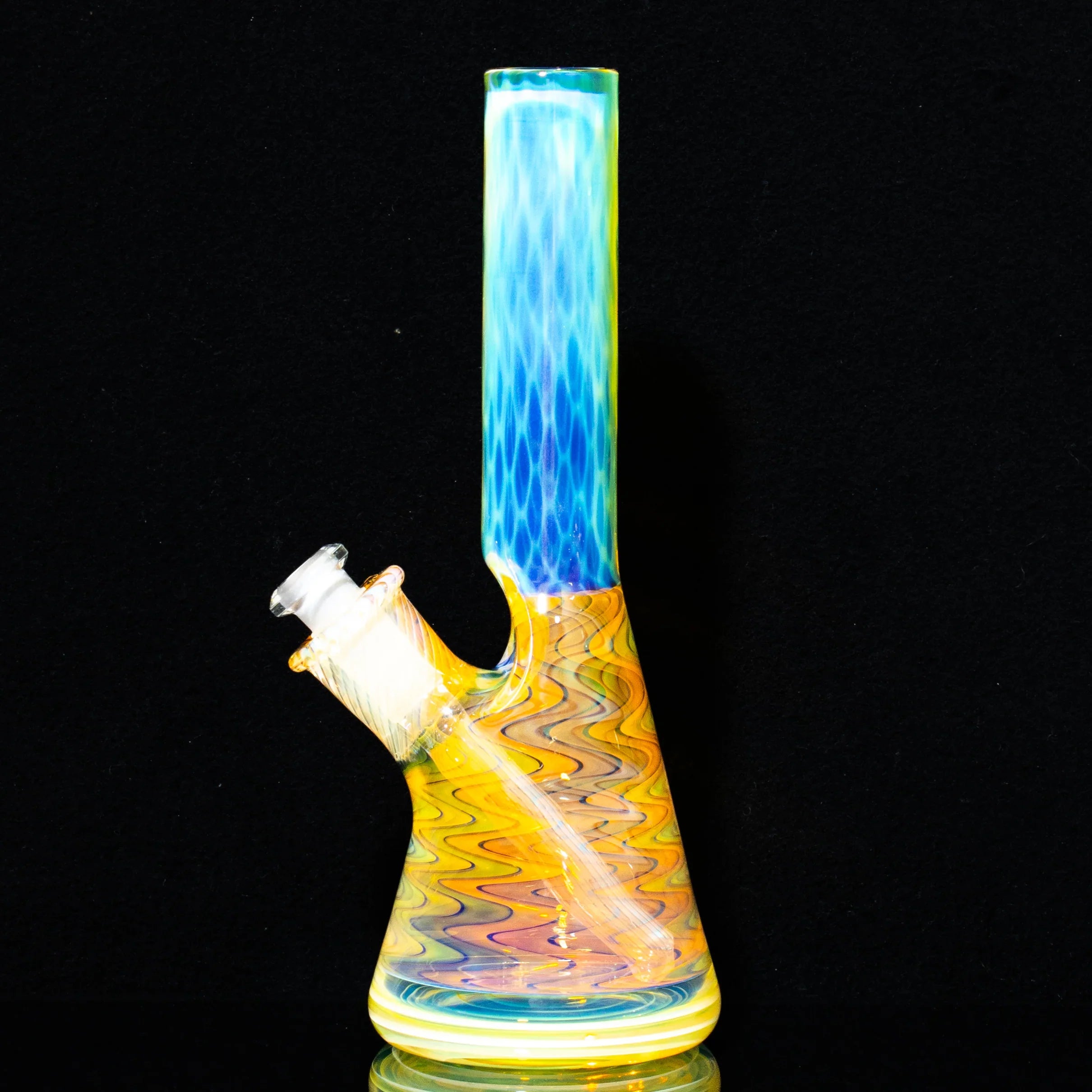 Colorful honeycomb pattern glass mini tube water pipe on black background