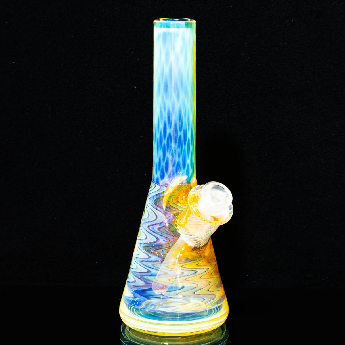 Colorful honeycomb mini glass water pipe with intricate linework on black background