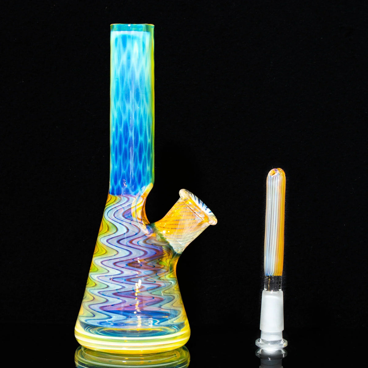 Colorful honeycomb pattern glass mini water pipe with matching removable downstem on black background