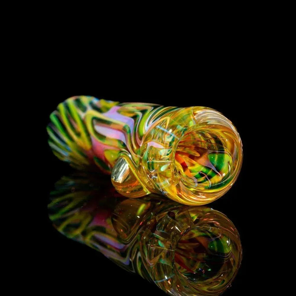 Colorful glass chillum pipe with spiral design on black reflective surface