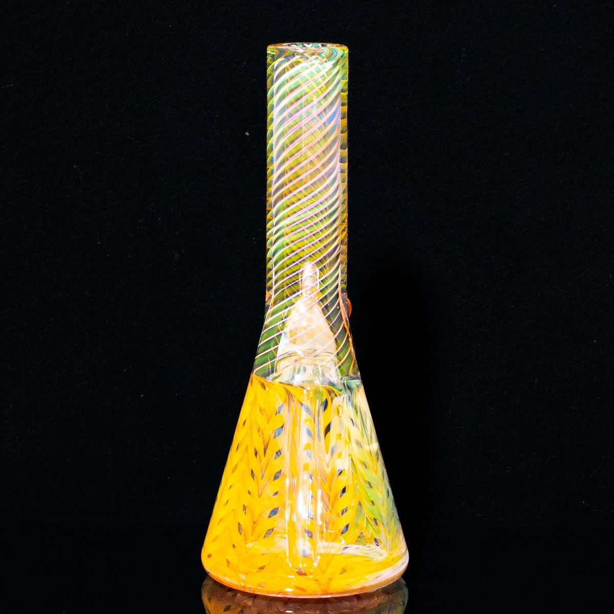 Hand-blown glass mini tube with yellow spiral design on black background