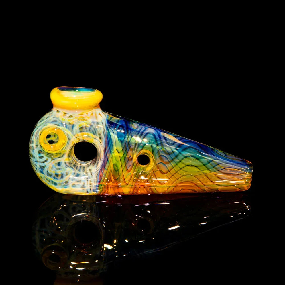 Colorful glass hand pipe with swirling patterns and yellow accents on a black background