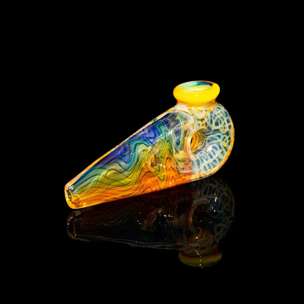 Colorful glass hand pipe with yellow rim and intricate squiggle designs on black background.