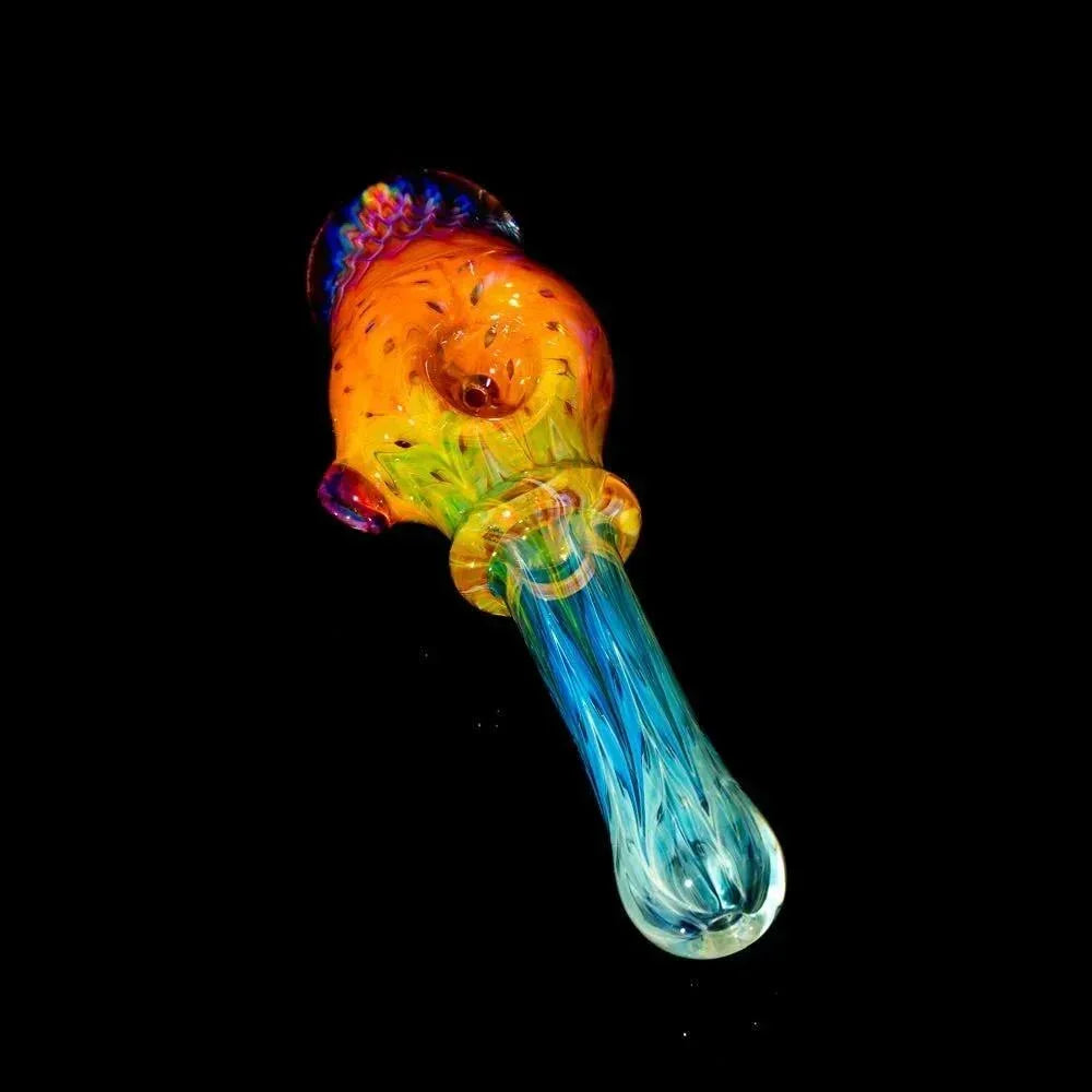 Colorful glass spoon pipe with honeycomb design on black background