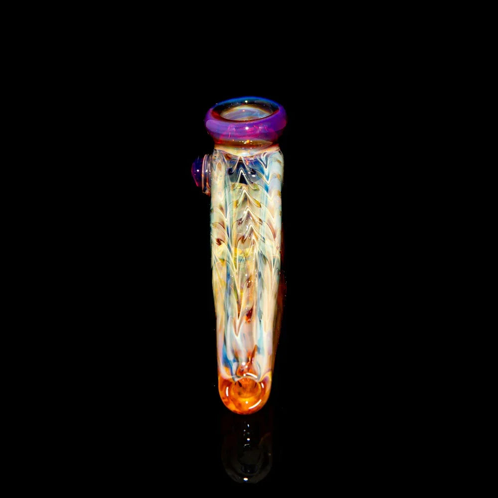 Colorful glass hand pipe with intricate patterns on a black background