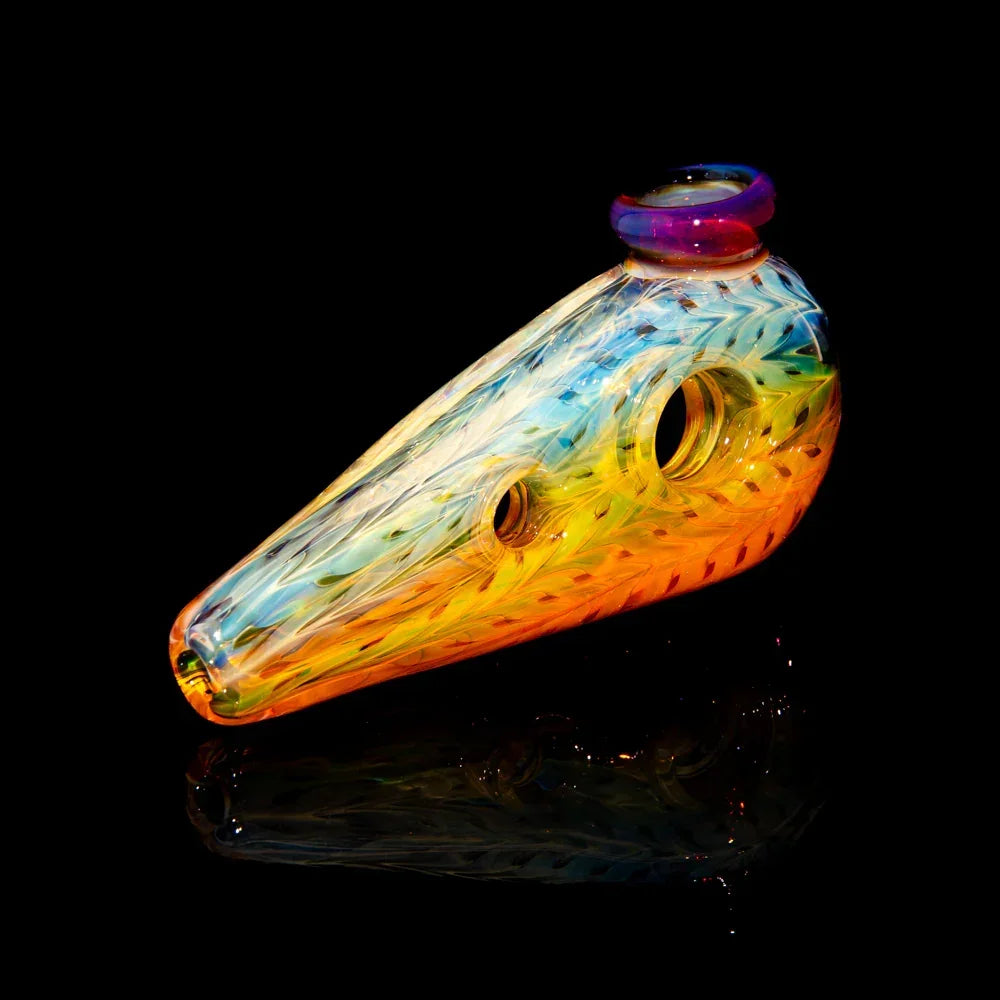 Colorful hand-blown glass pipe with intricate patterns on a black background