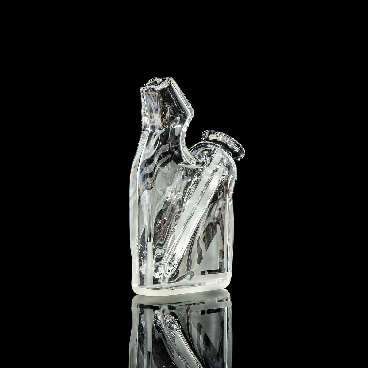Clear sculpted glass water pipe with angled mouthpiece on black background