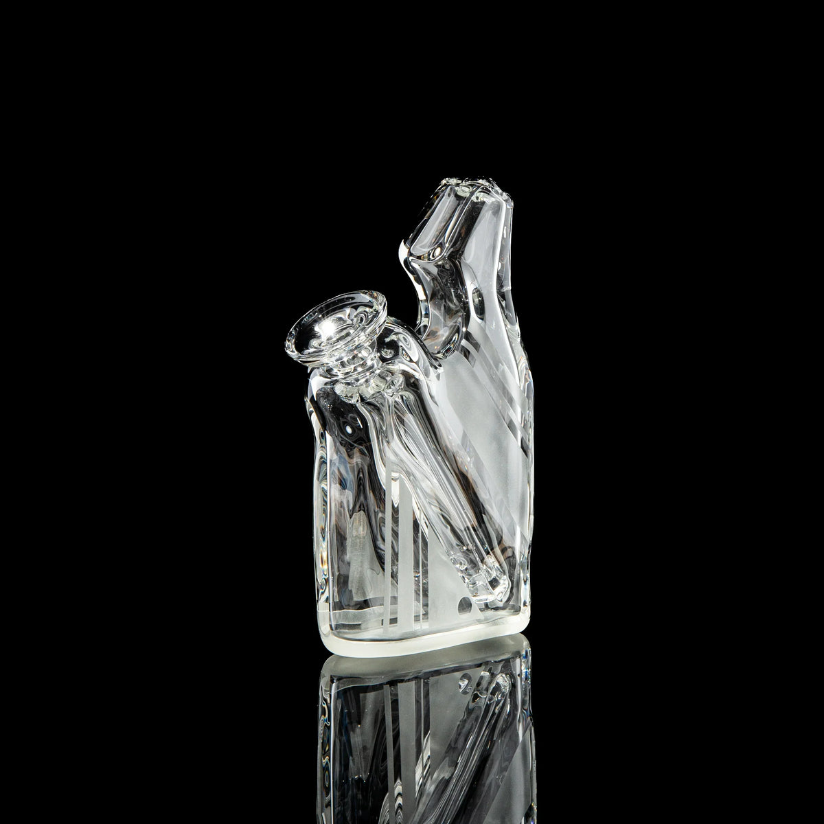 Clear glass water pipe with modern angled design on black background