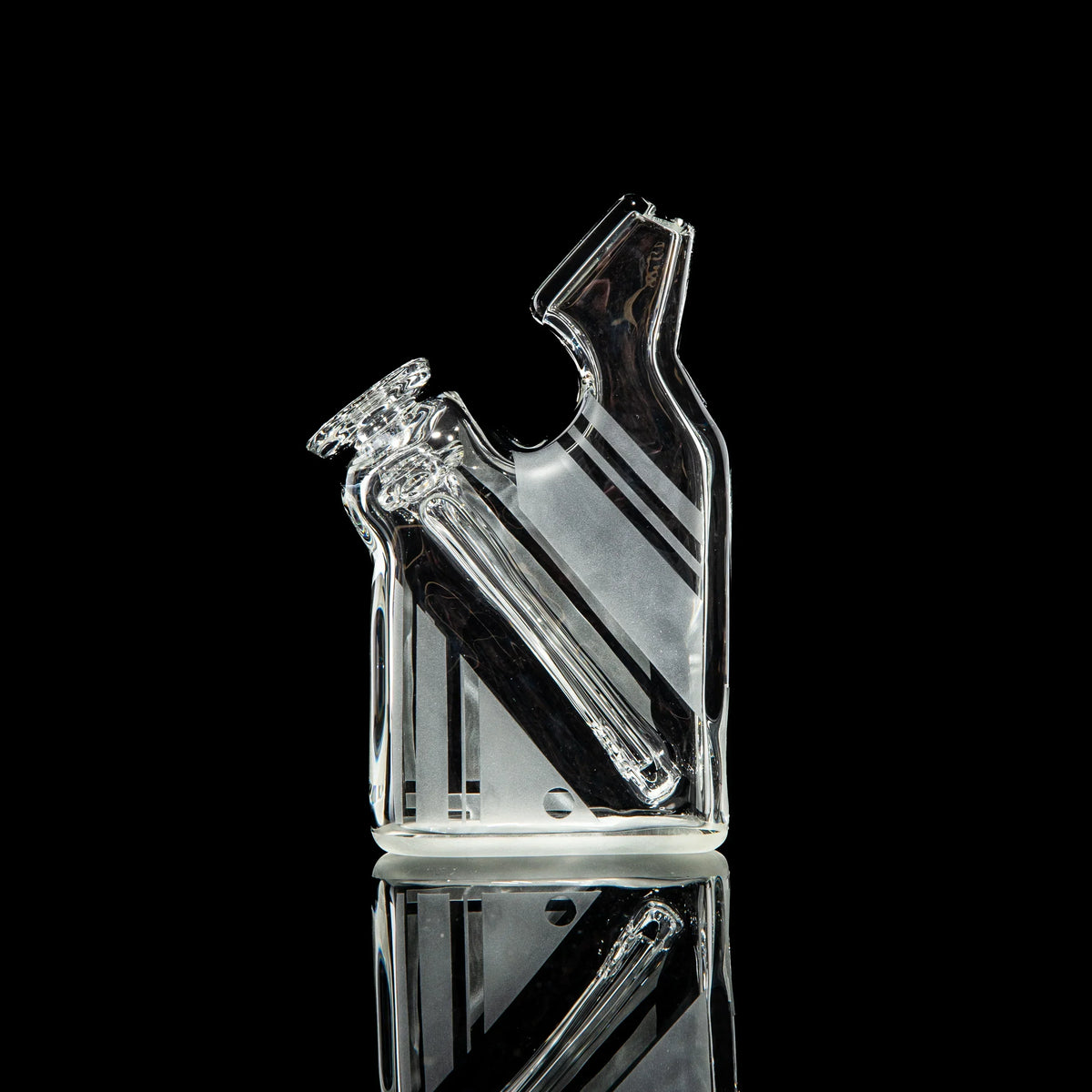 Clear glass water pipe with angled mouthpiece and geometric etched stripes on black background.