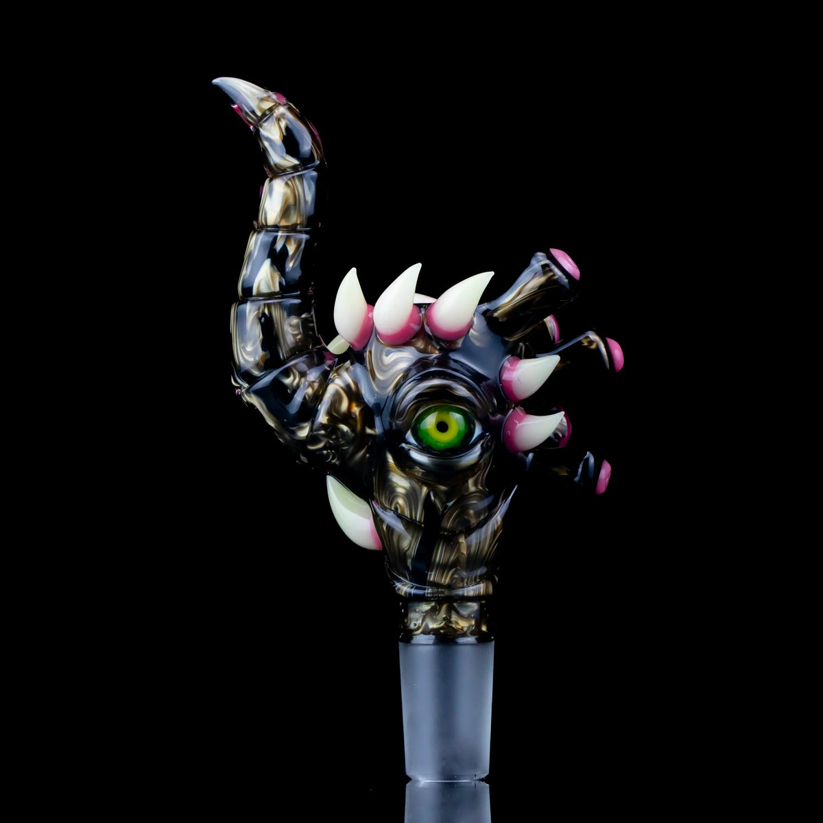 Heady glass slide shaped like a clawed monster hand with green eye and pink spikes, 18mm joint