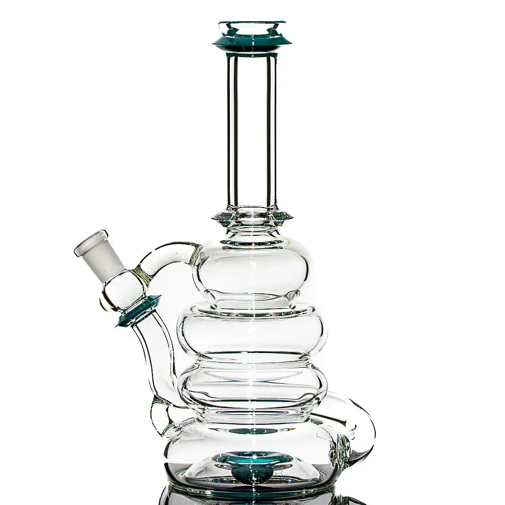 Clear glass water pipe with teal accents, multi-chamber design, isolated on white background.