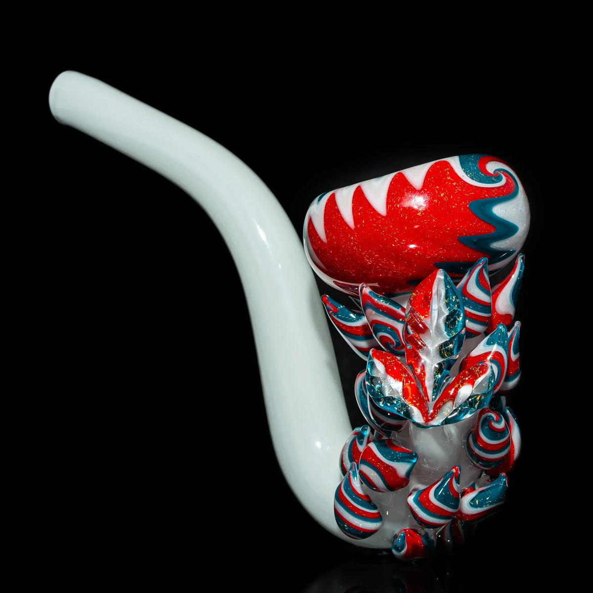 Colorful glass pipe with red, white, and teal swirl accents on a black background