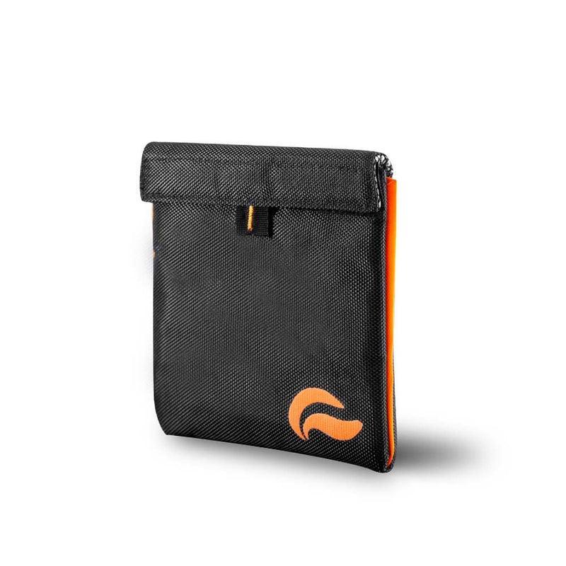 Black and orange smell-proof pouch with textured exterior and secure closure