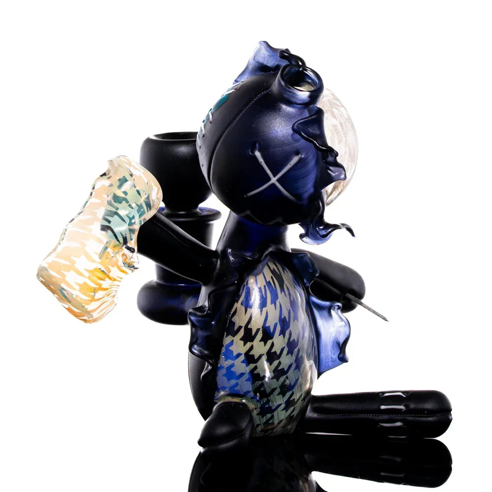 Handcrafted glass art doll with houndstooth patterns, designed for collectors or display.