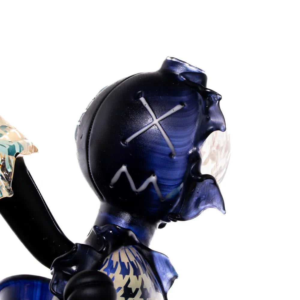 Handcrafted glass art doll with houndstooth pattern and sculpted face details
